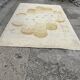 Large rug with floral decoration.
