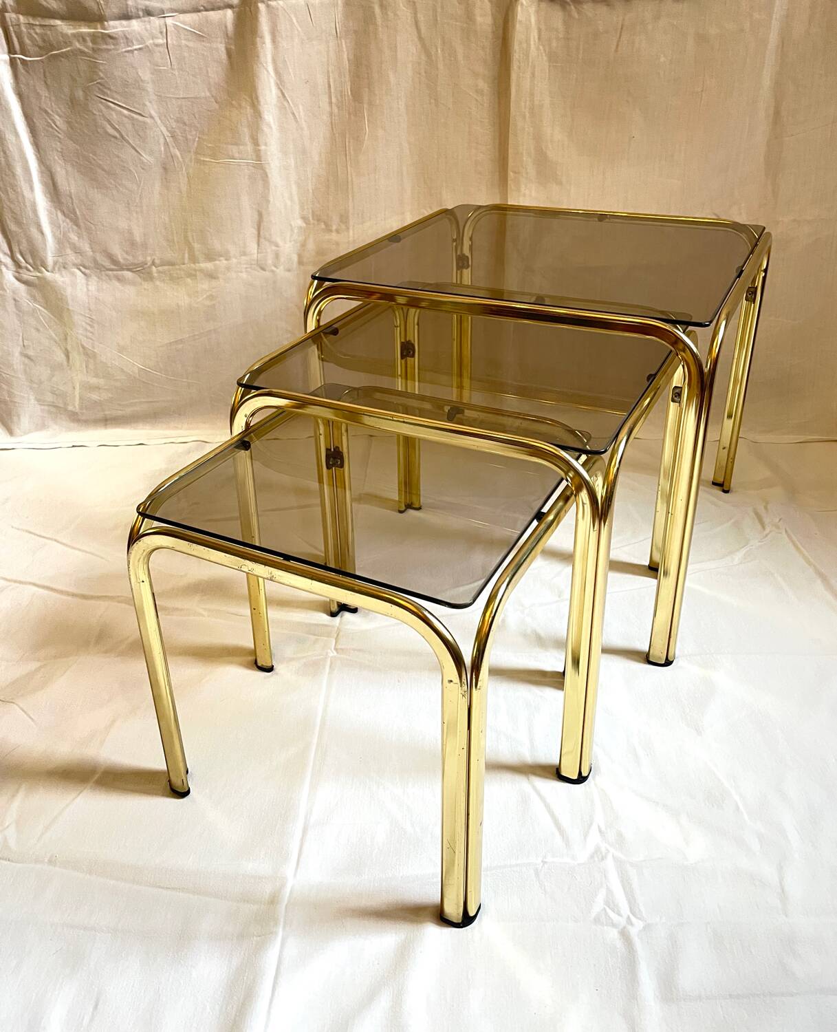 Brass and smoked glass nesting tables