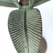 Antique palm tree-shaped candlestick in patinated metal
