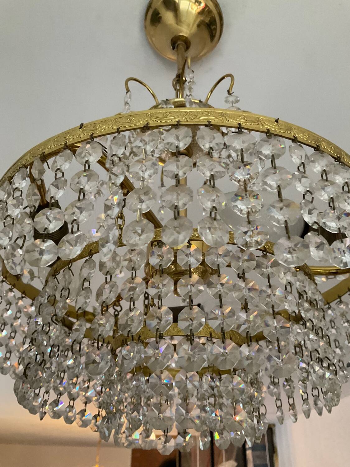 Cascade chandelier with crystal and brass tassels