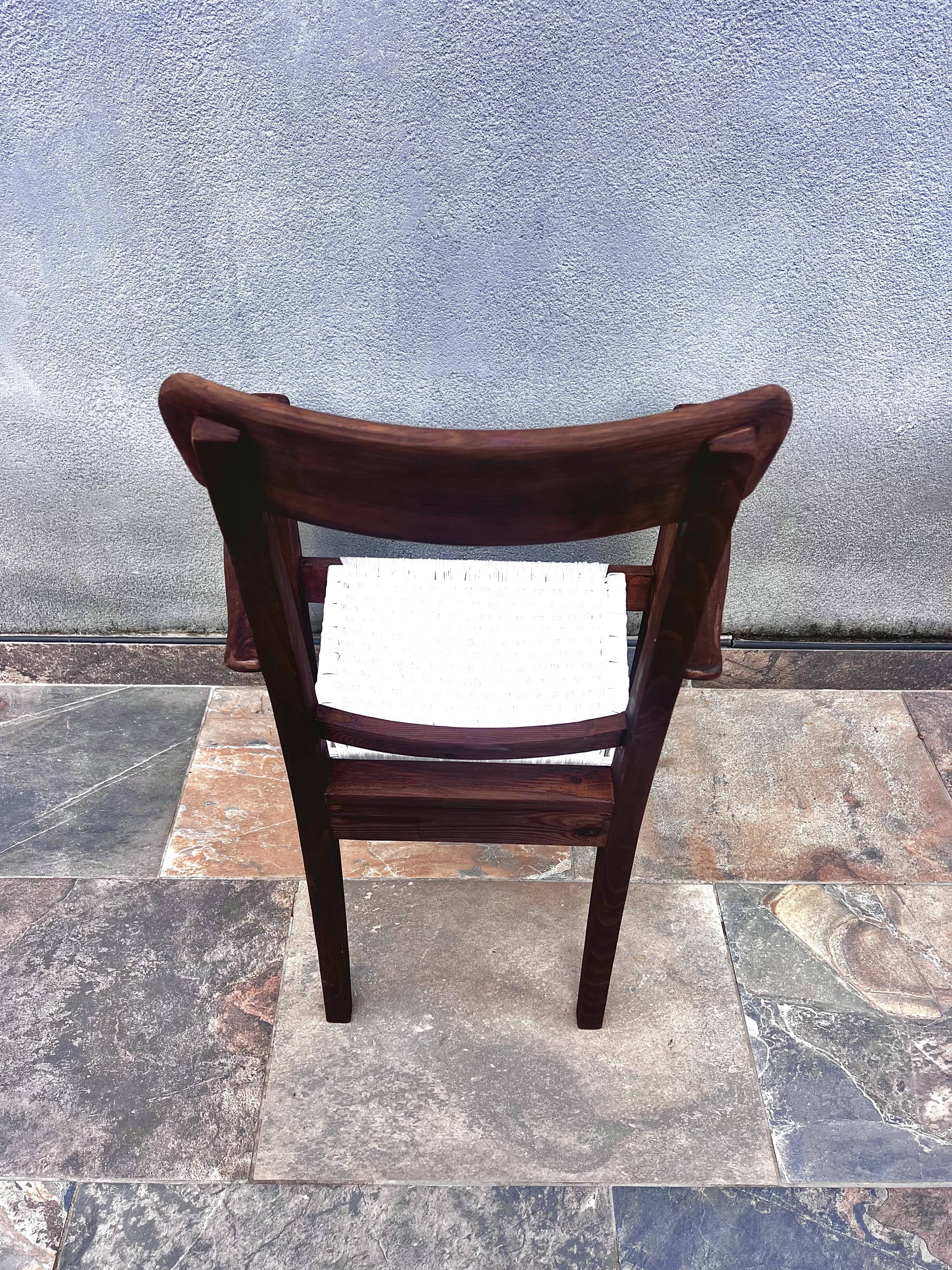 Scandinavian chair in wood and woven natural fibre.