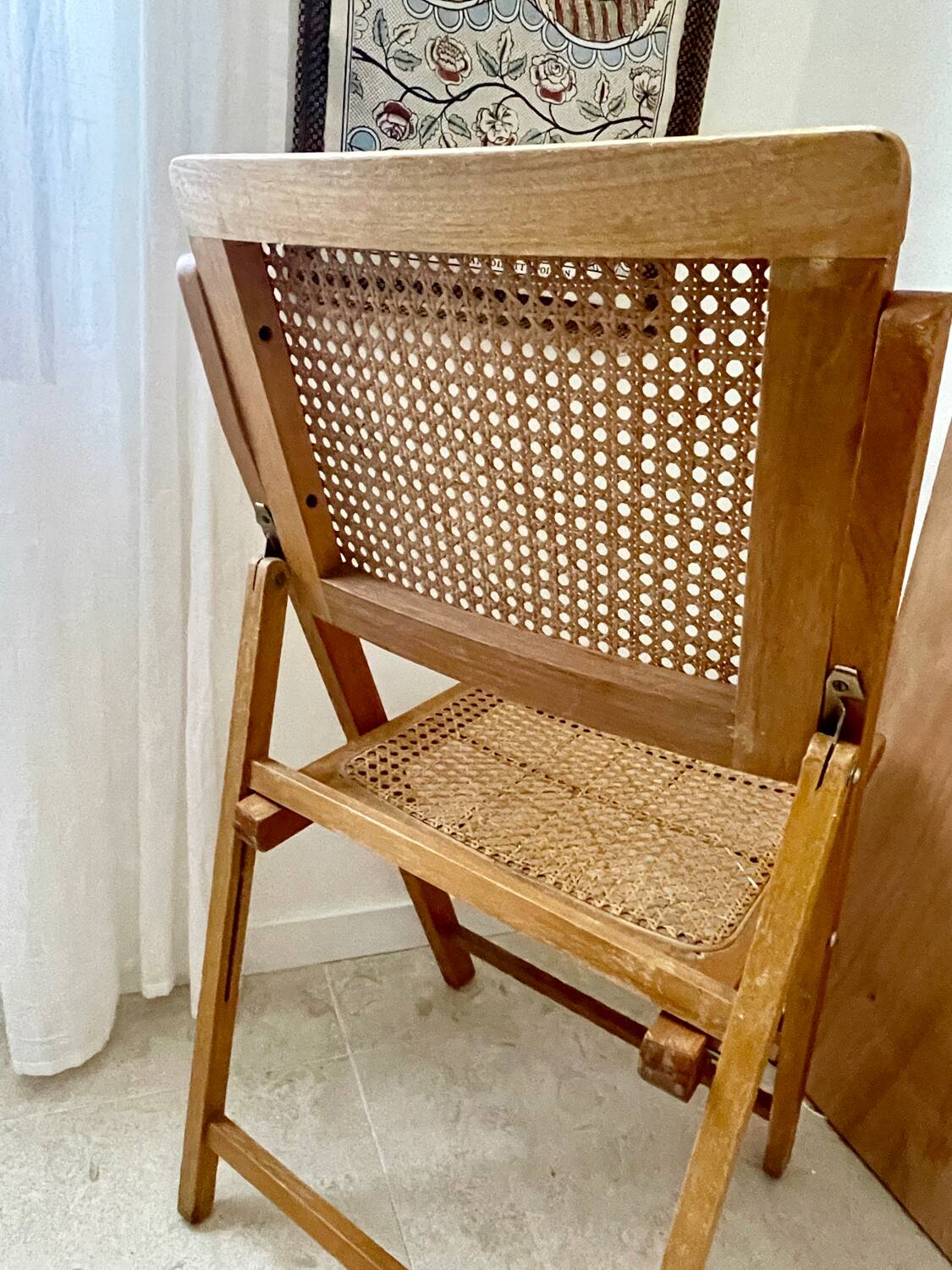 Folding wooden and cane chair