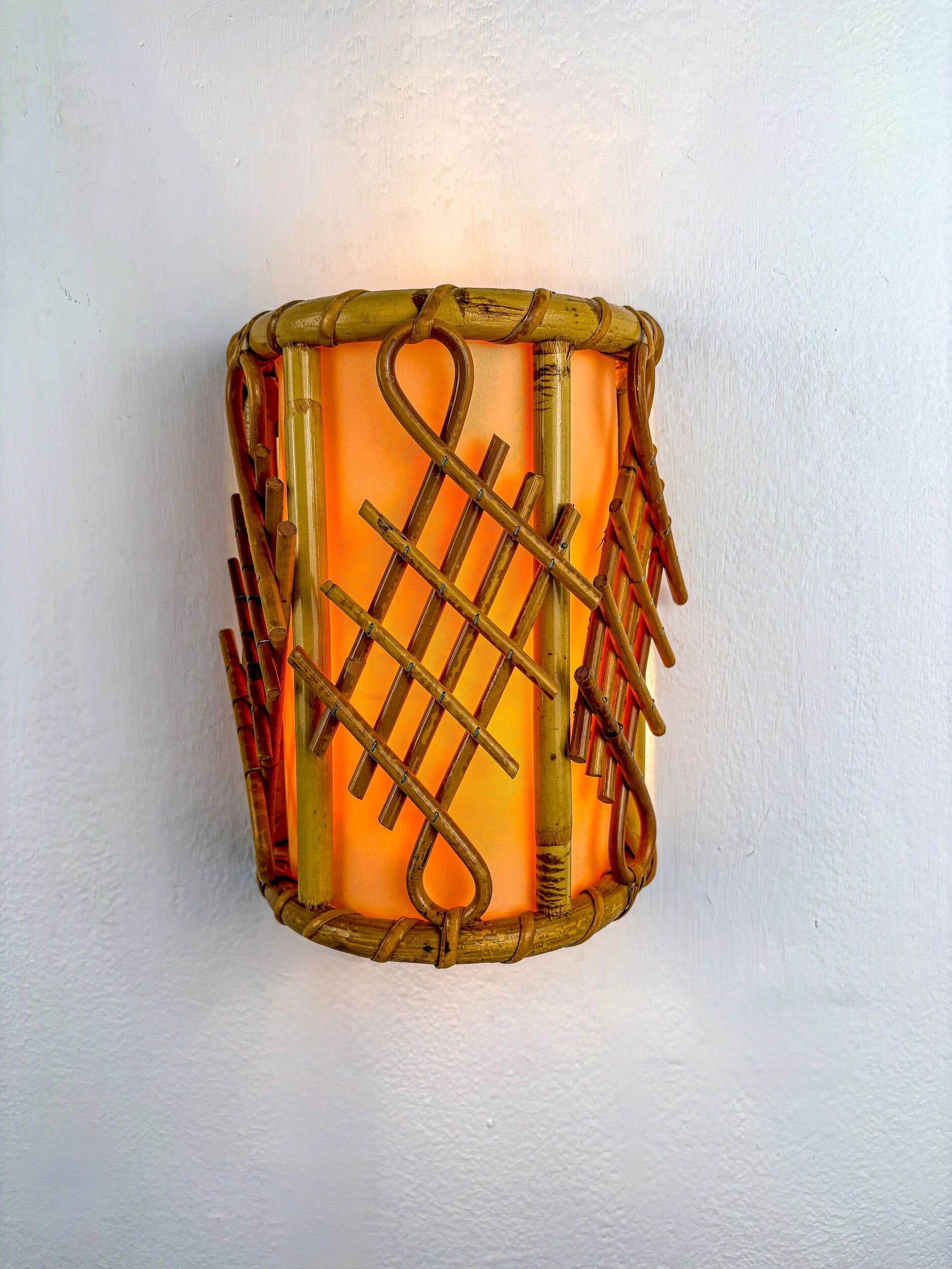 Pair of mid-century rattan wall sconces, circa 1970s, Italy