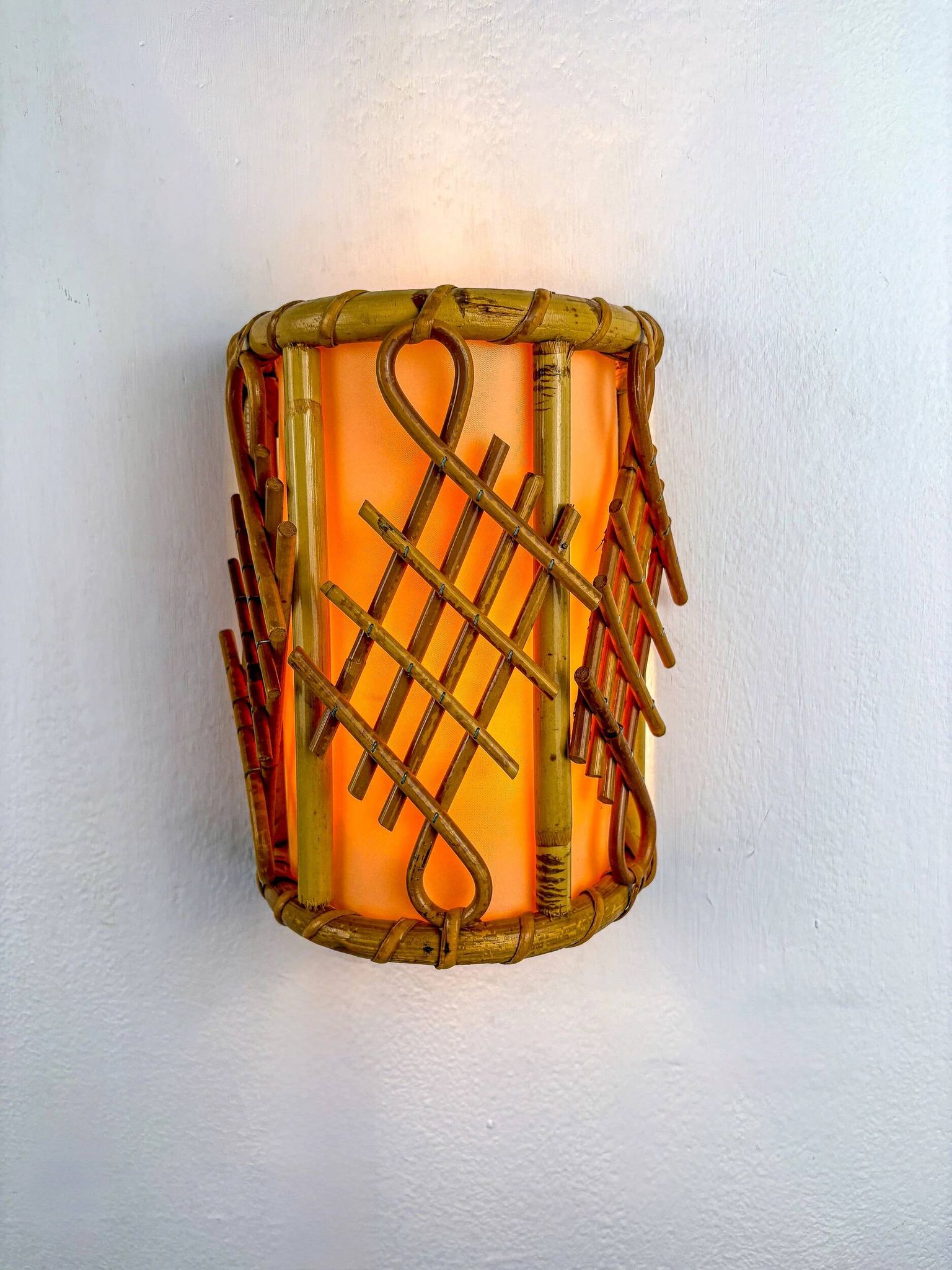Pair of mid-century rattan wall sconces, circa 1970s, Italy