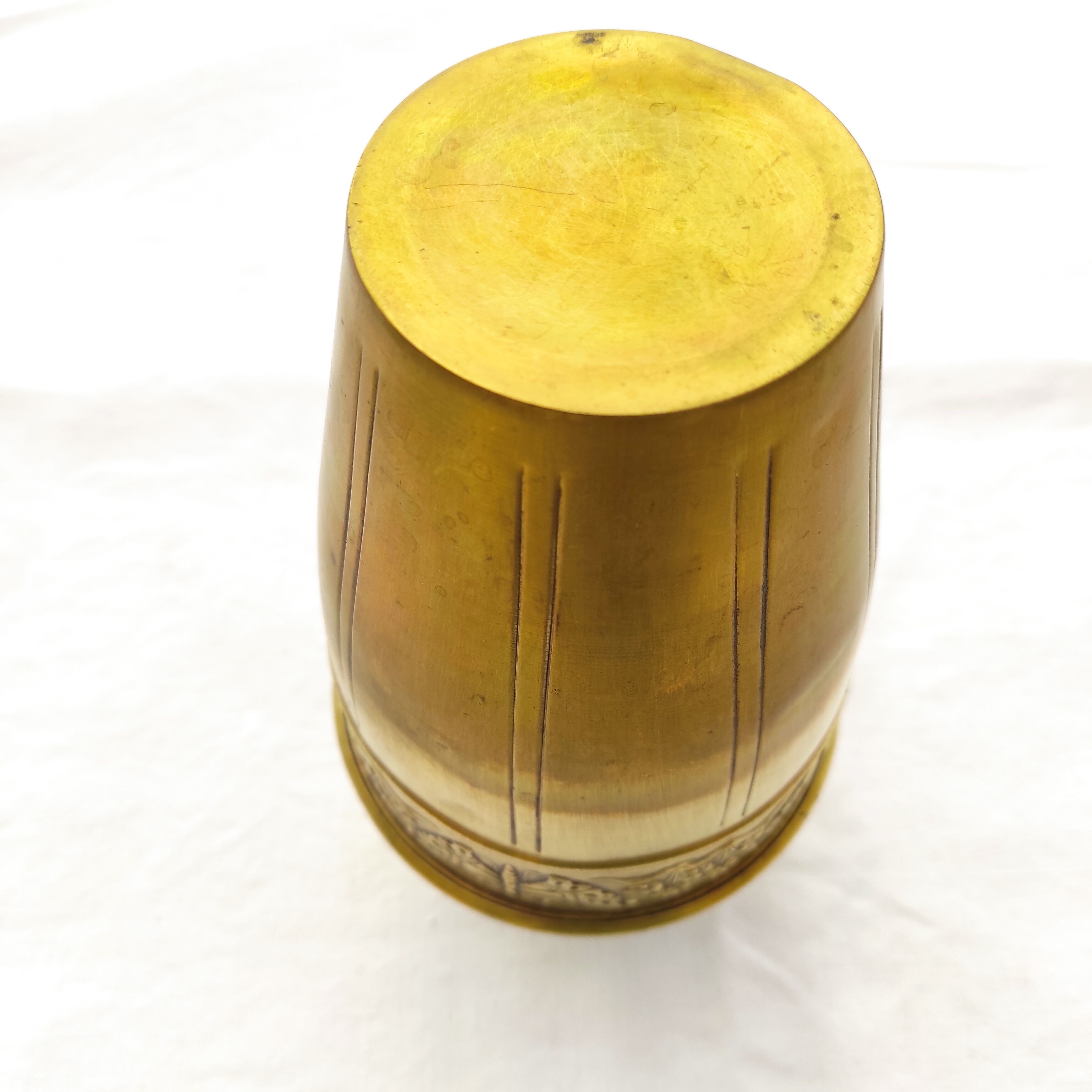 Vase in brass worked with flowers and butterflies around 1930