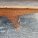 Vintage woven rattan furniture with tapered legs.