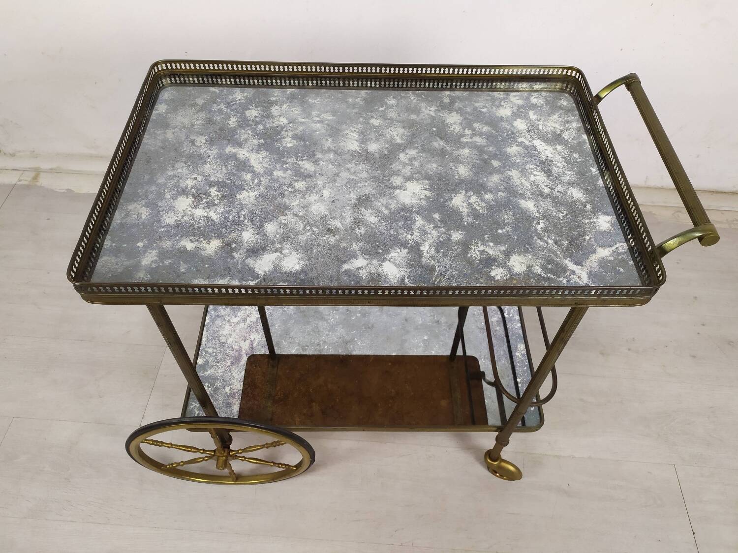 Brass and glass rolling trolley