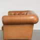 Sheepskin 2.5-seater Chesterfield sofa in a light cognac colour