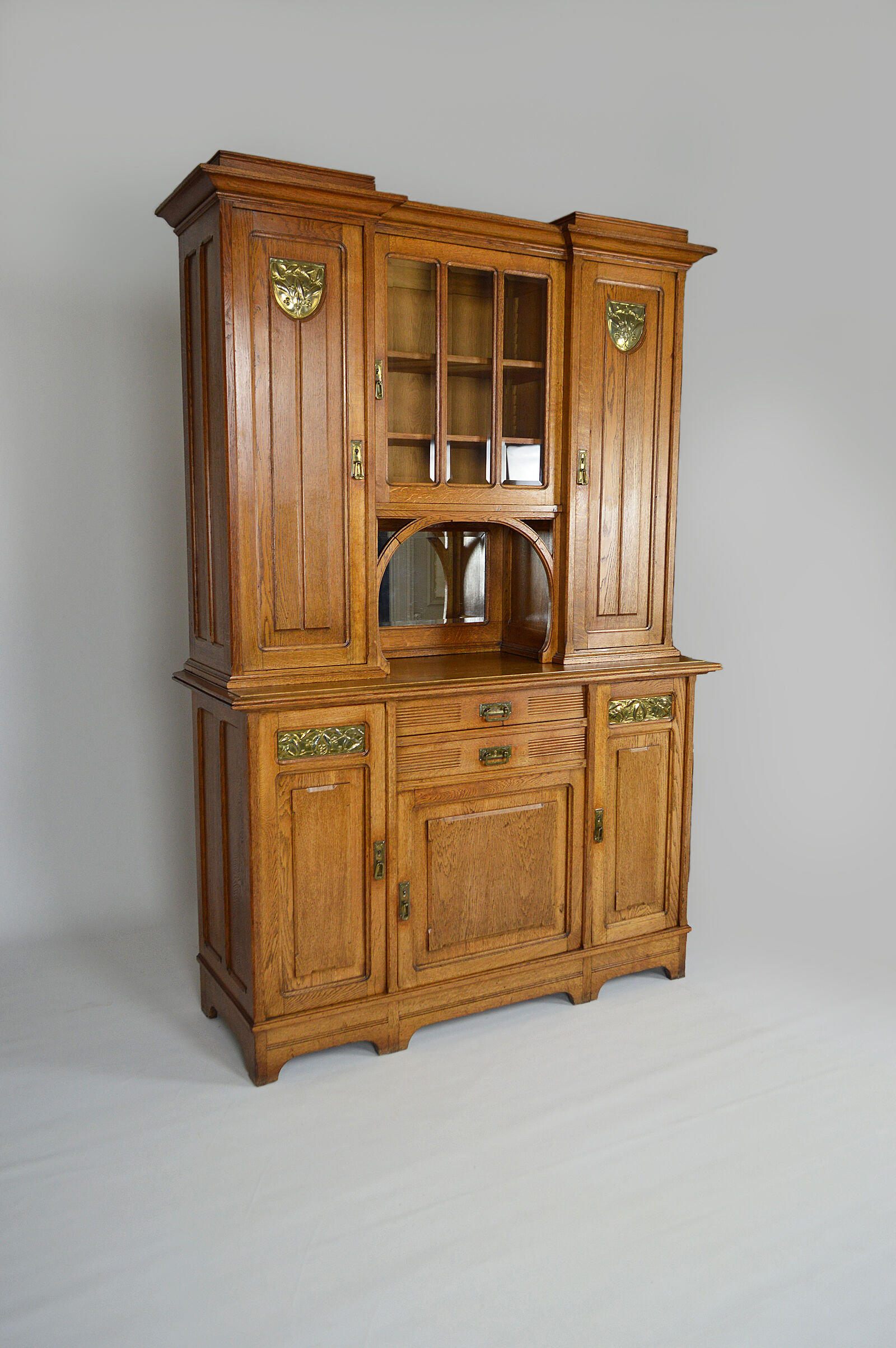 Art Nouveau oak buffet and dinanderie panels, circa 1910