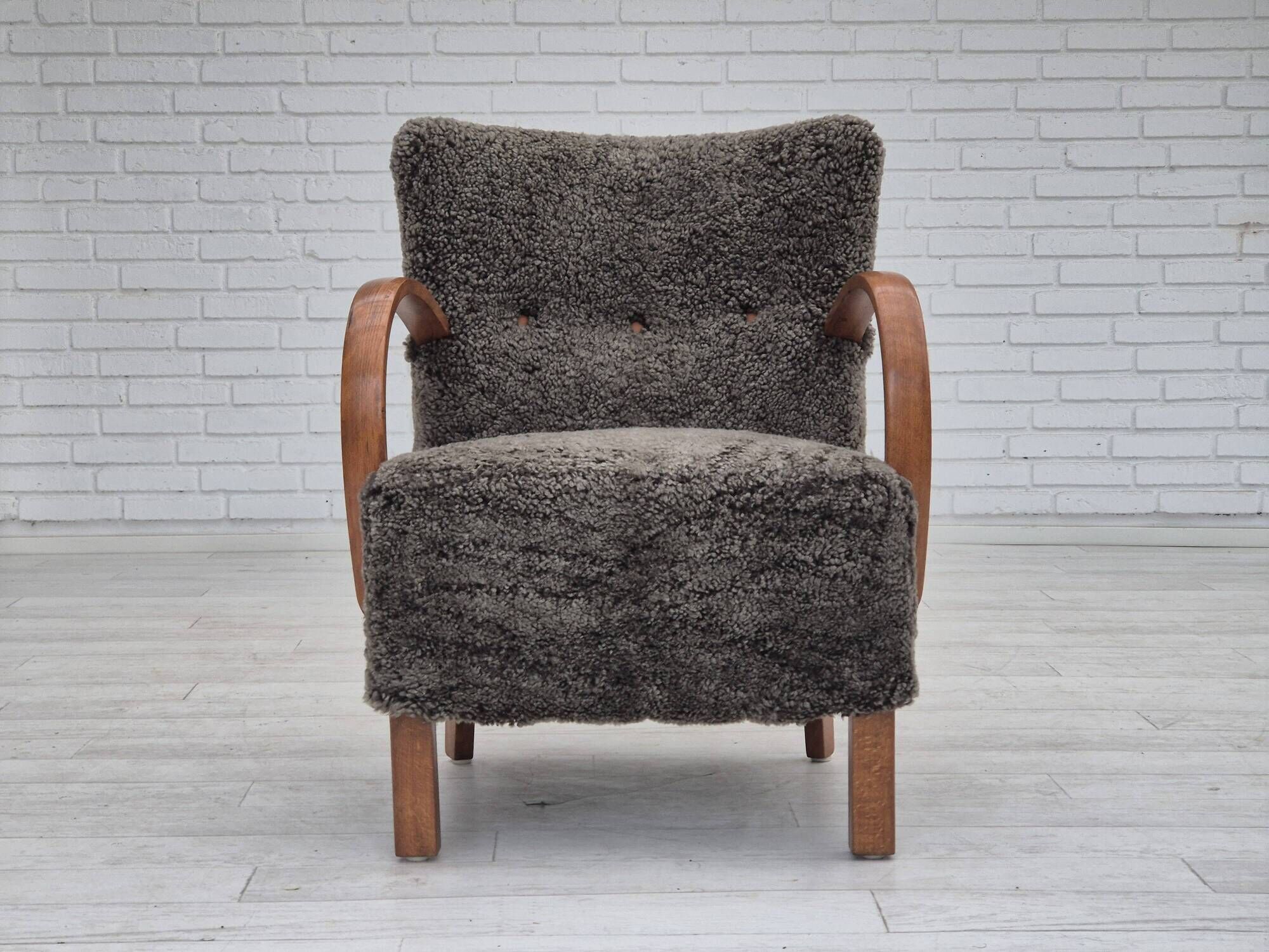 1960s, completely reupholstered Danish art deco armchair, genuine sheepskin "Wellington".