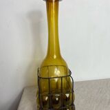 Glass carafe encased in wrought iron