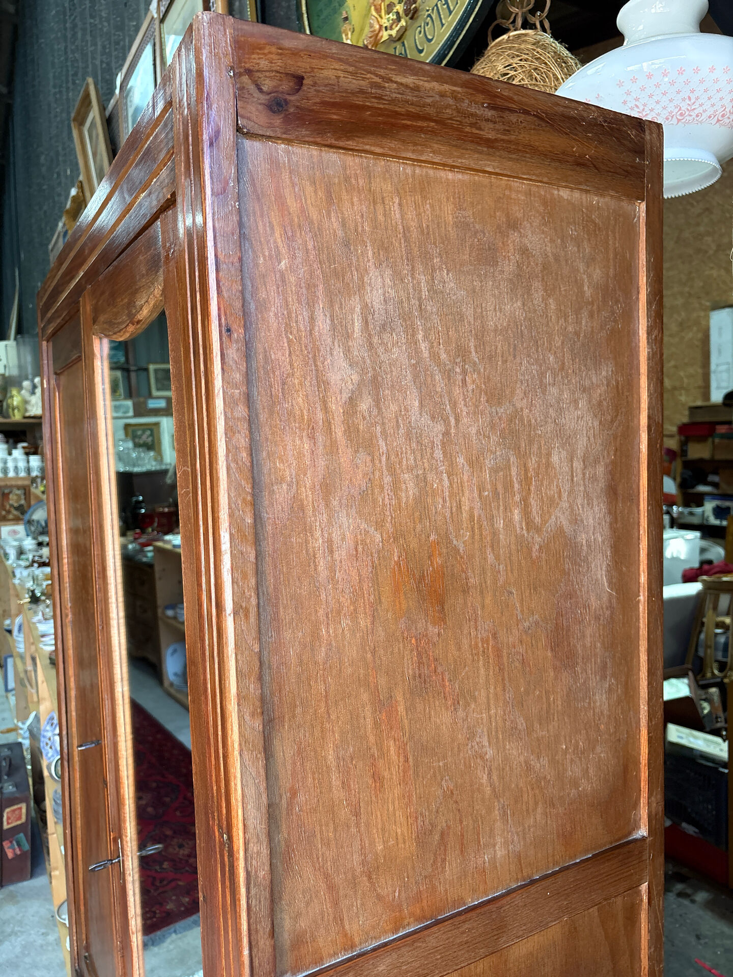 Antique Parisian wardrobe with mirror, hanging space and drawers.