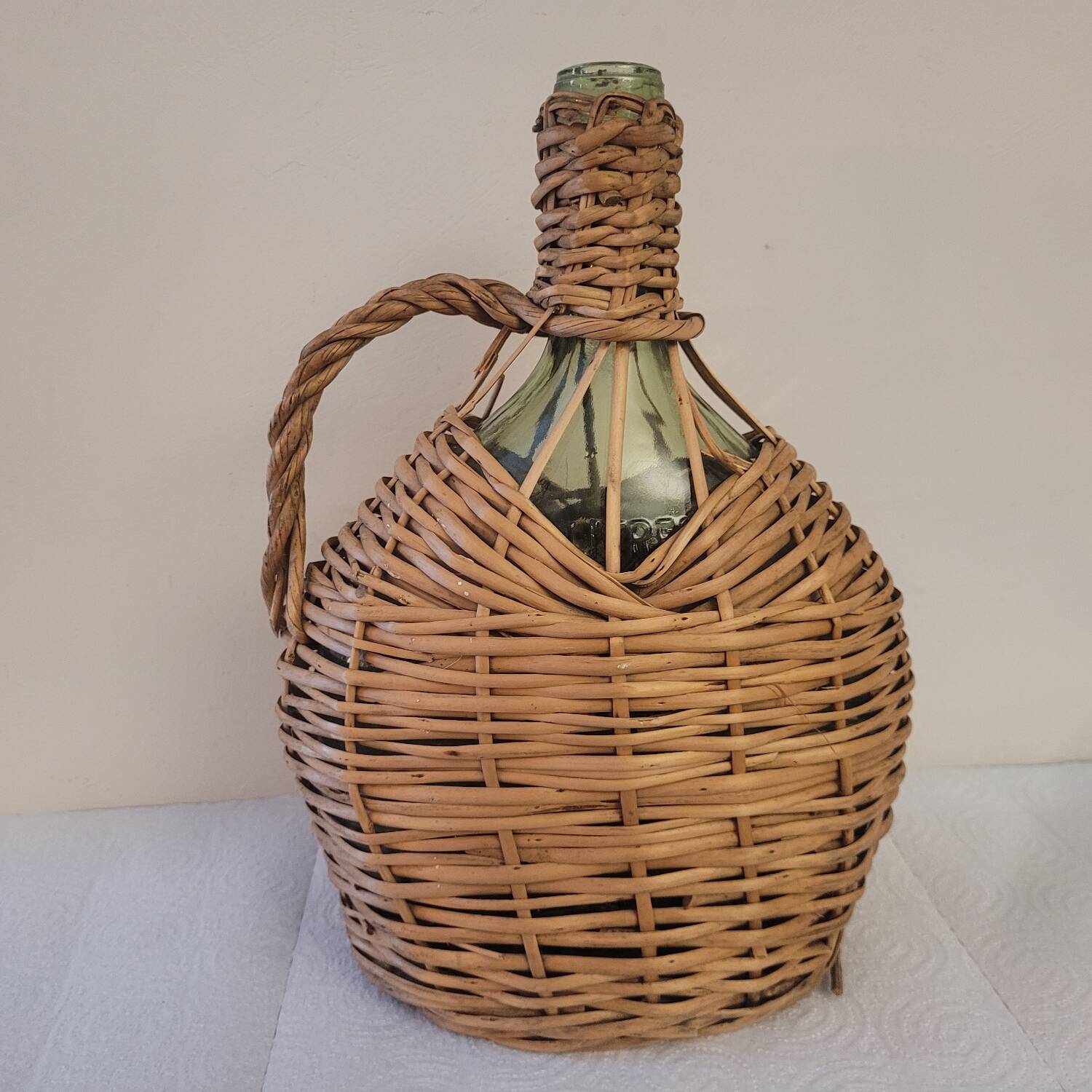 Green glass carafe with wicker covering – 2 litres – 1960s–1970s