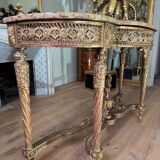 Console with 4 legs from the end of the 19th century in gilded wood in the Louis XVI style.
