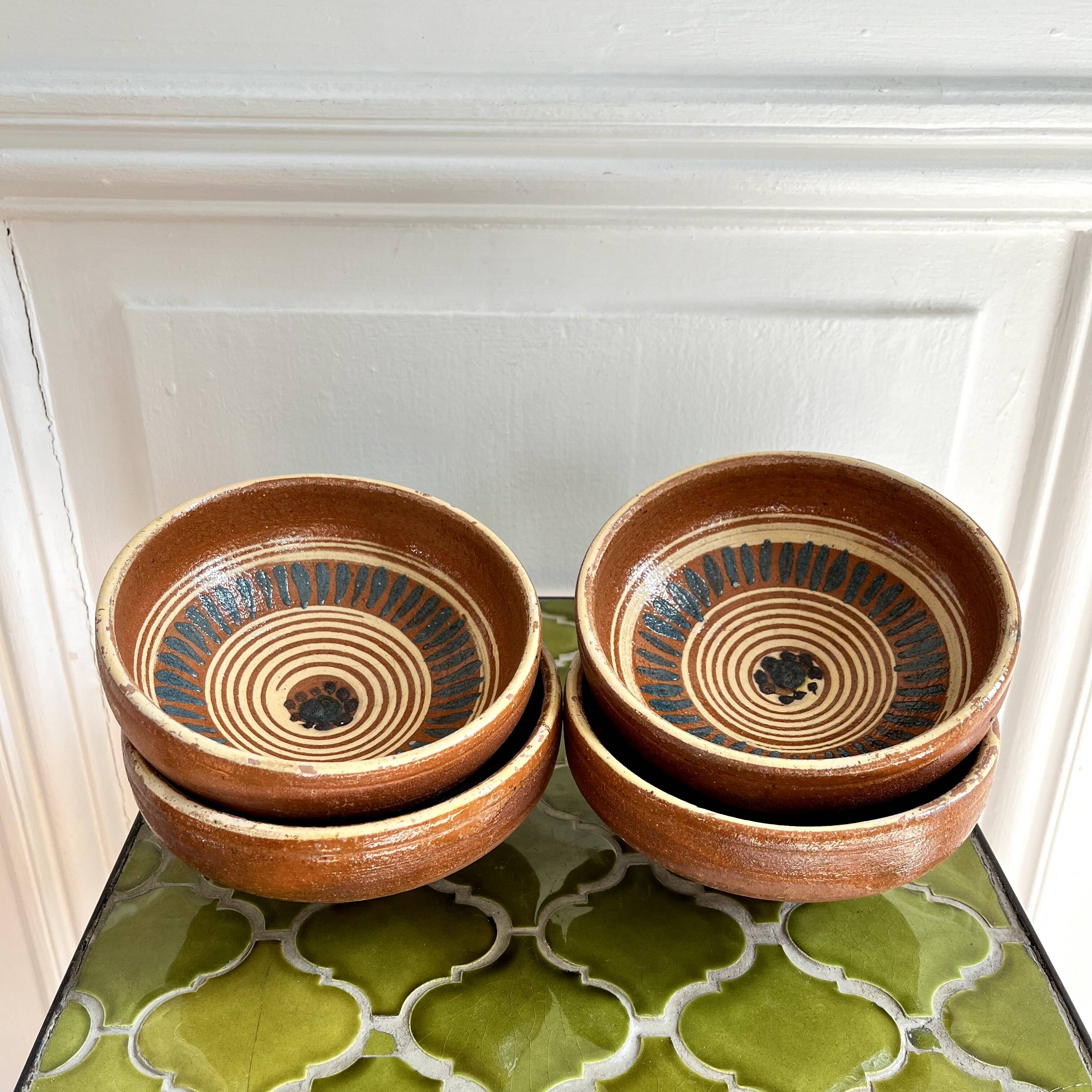 4 old handcrafted pottery bowls