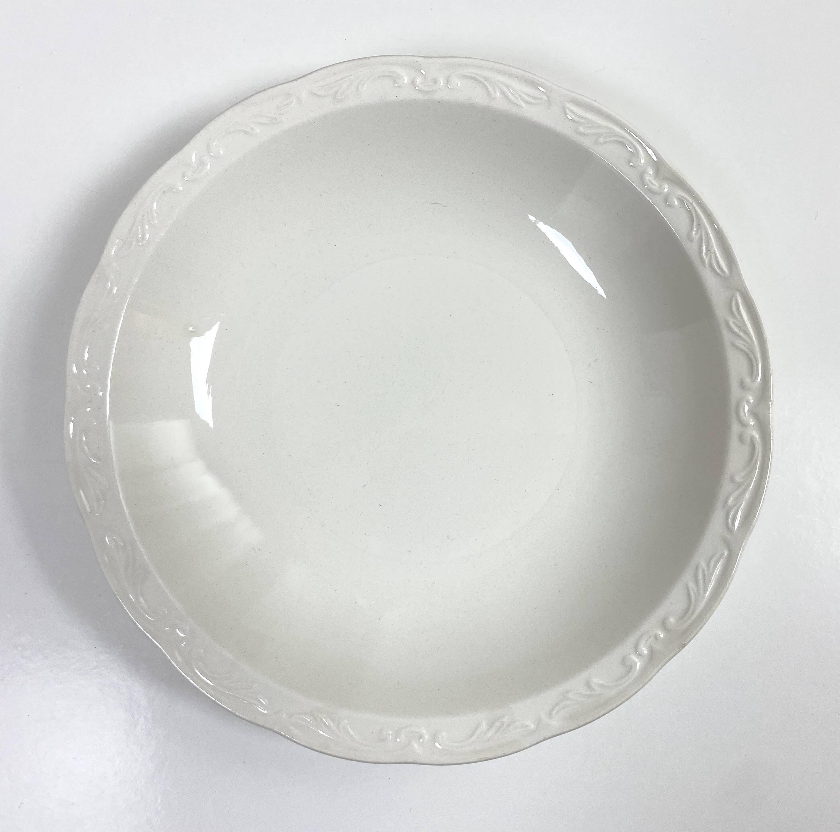Set of two matching soup plates, one plain and one decorated