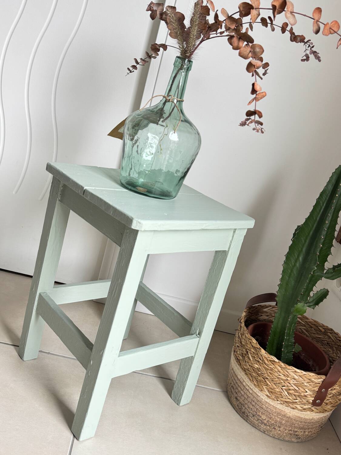 Antique almond green wooden stool
