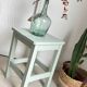 Antique almond green wooden stool