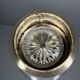 Vintage brass floor ashtray with glass shelf in Empire style.