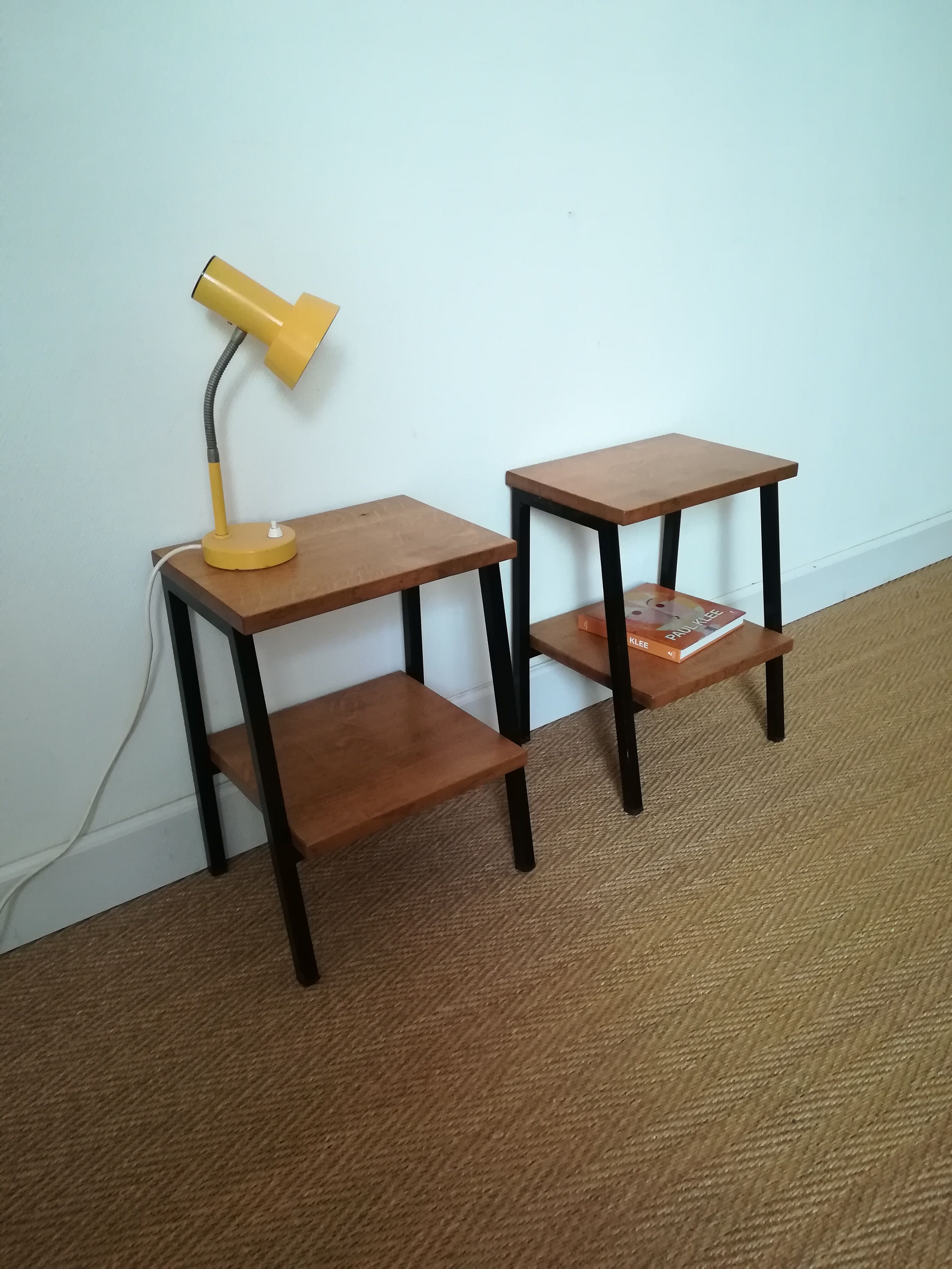 A pair of bedside tables