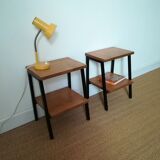 A pair of bedside tables