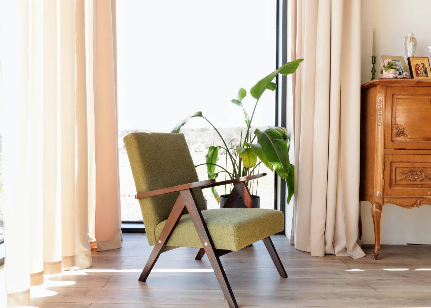 Vintage armchair in moss green bouclé design by H. Lis.