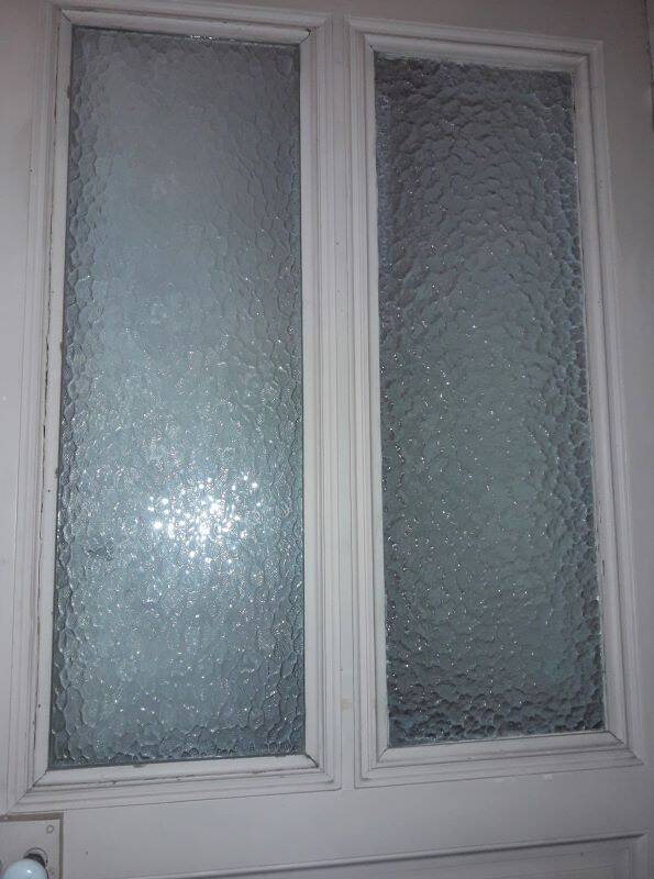 Large glazed door and its old glazed transom.