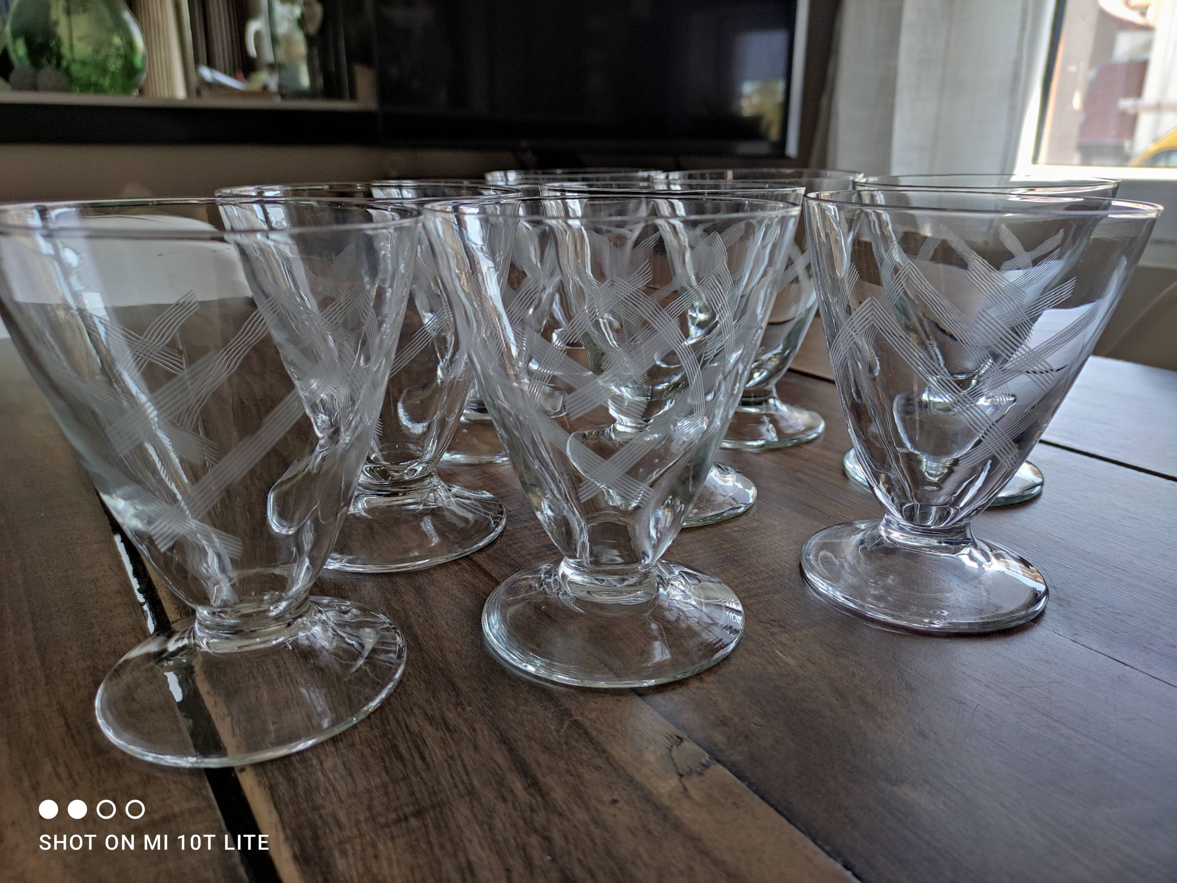 Set of 9 conical glasses on pedestal in antique chiseled glass crosses