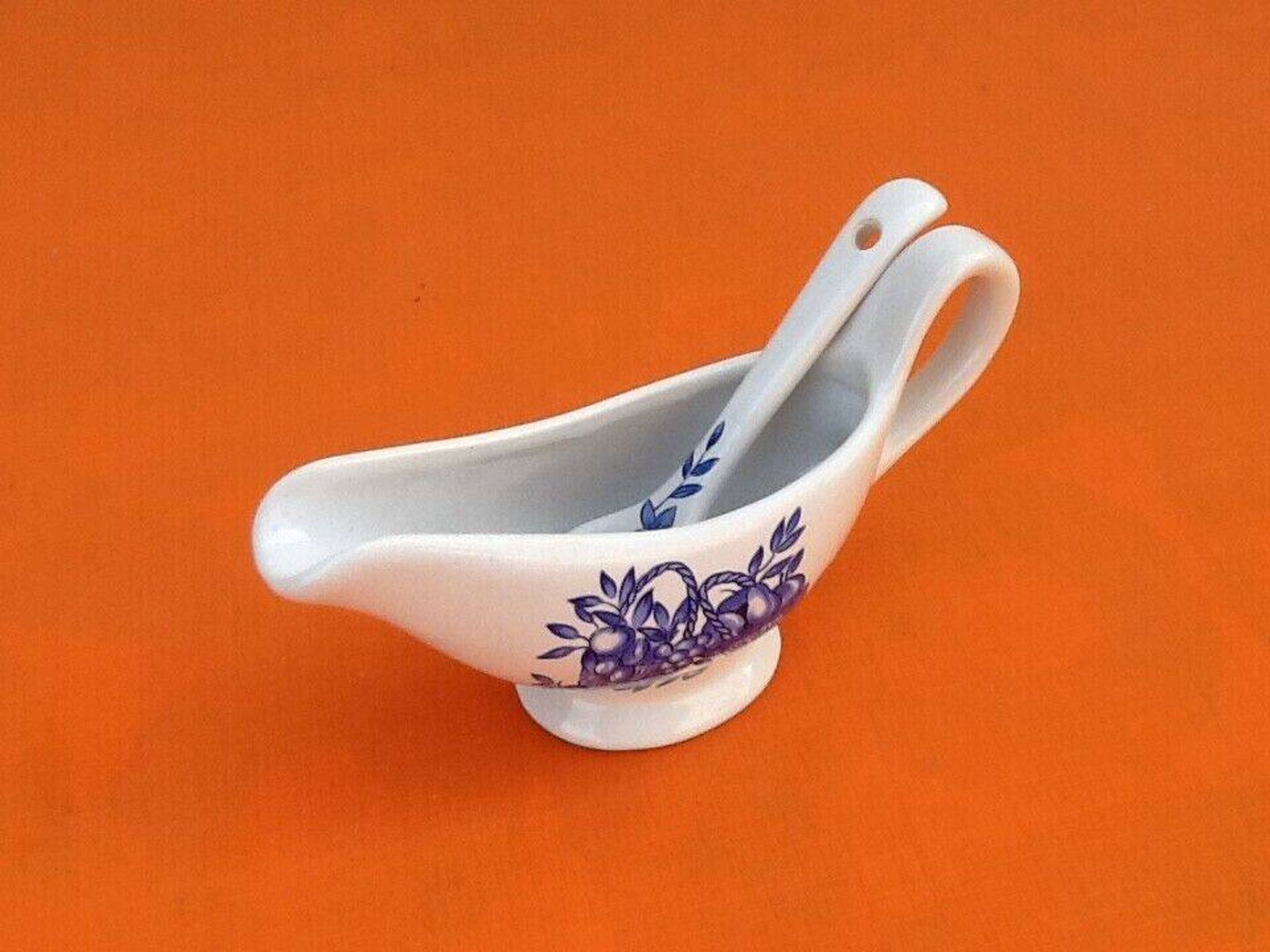 White porcelain gravy boat, fruit basket decor
