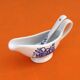 White porcelain gravy boat, fruit basket decor