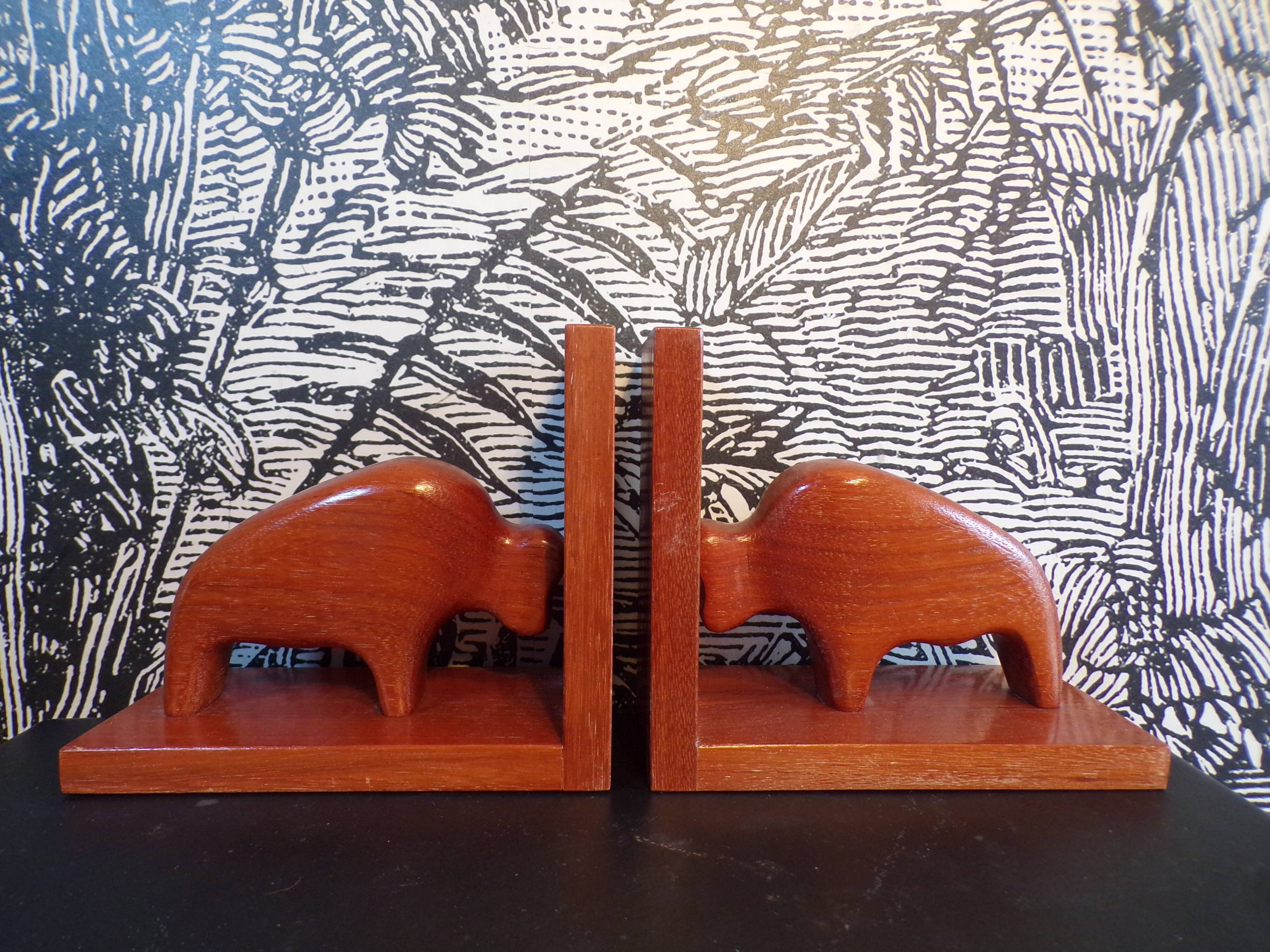 Pair of teak bookends in the shape of a bison