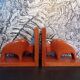 Pair of teak bookends in the shape of a bison