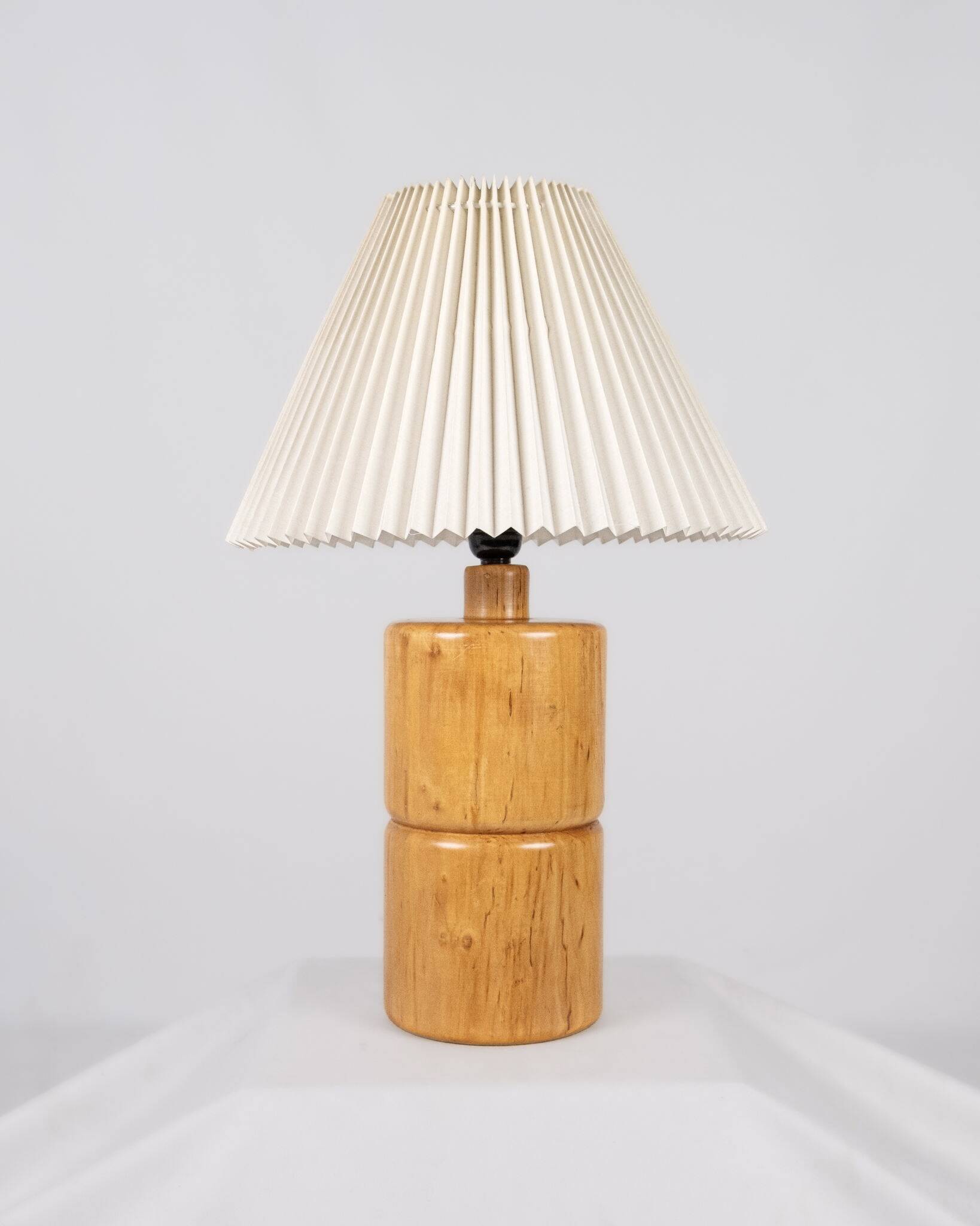 Cylindrical table lamp made of solid turned wood, France, 1970.