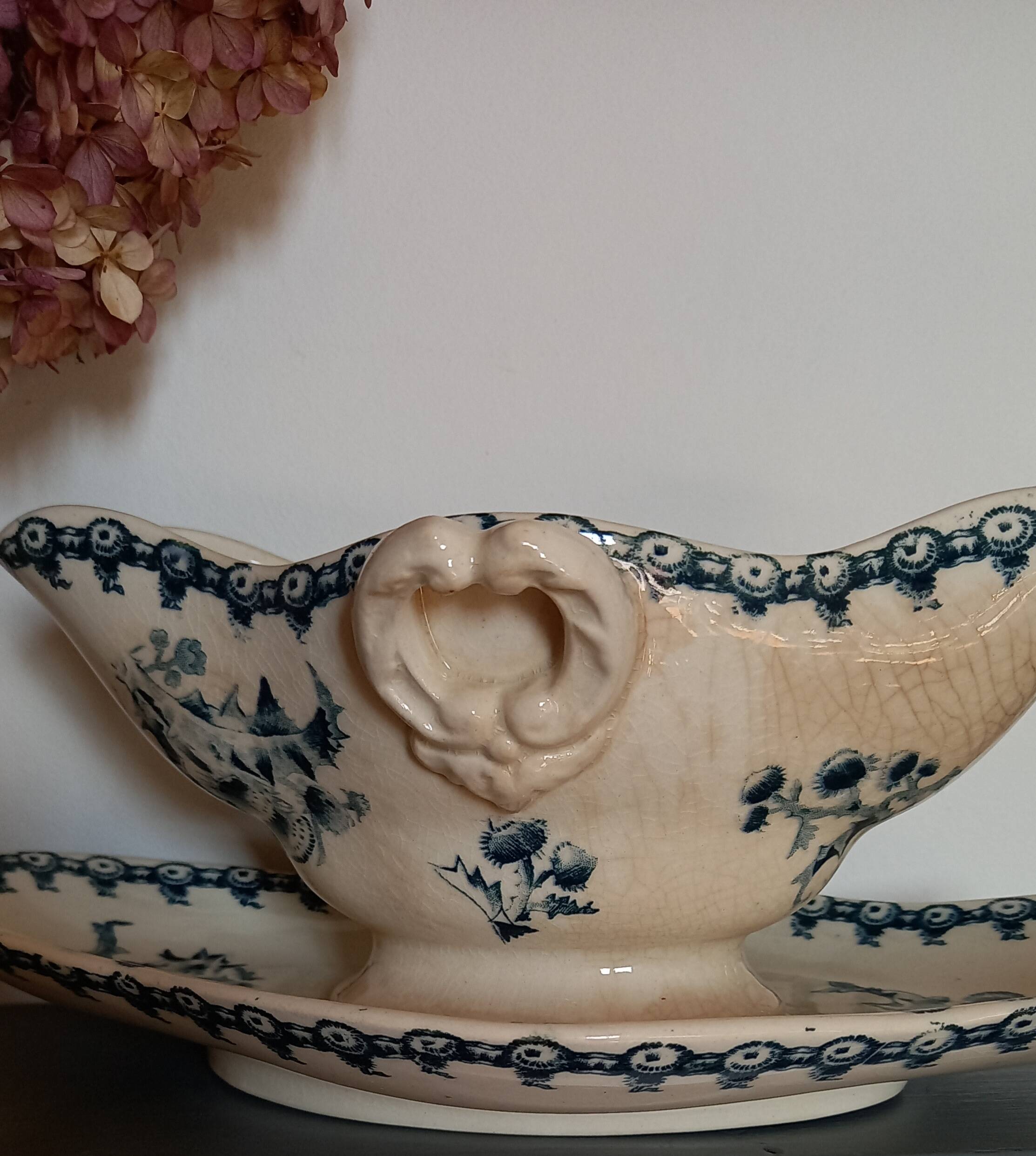 Old gravy boat on frame in terre de fer earthenware by gien, “chardons” model in blue-green