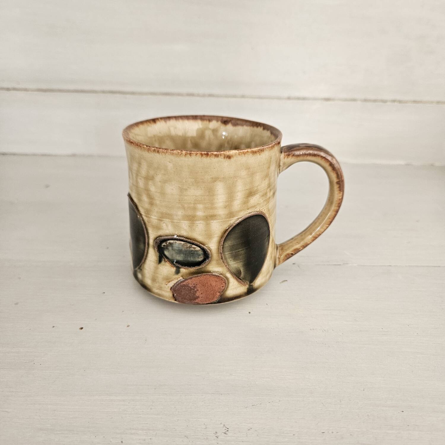 Set of 4 ceramic mugs, glazed stoneware, assorted vintage designs.