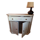 Wooden sideboard with floral patterns