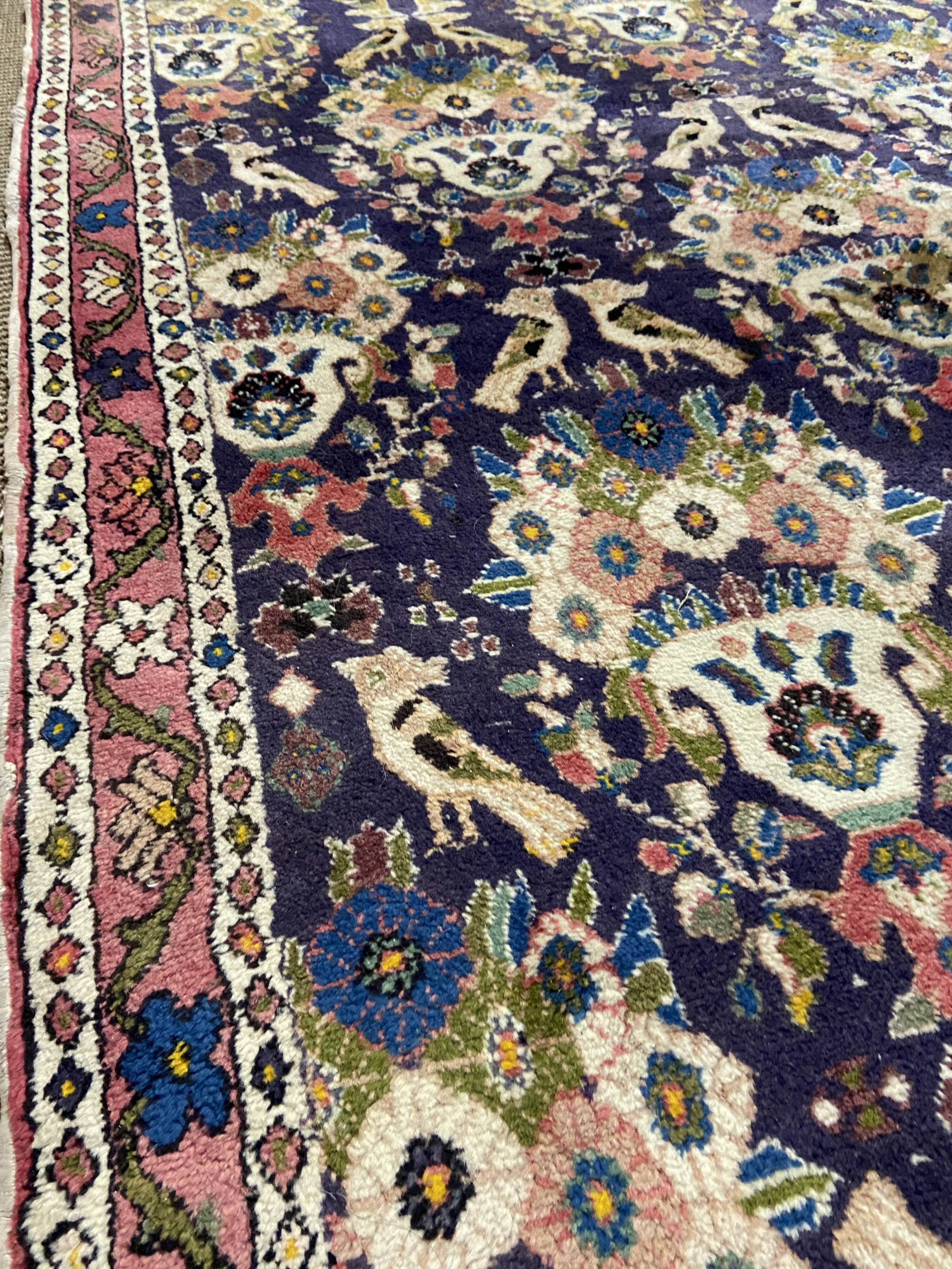 Antique Oriental rug from a nomadic tribe, 1950-1980, birds on a purple background