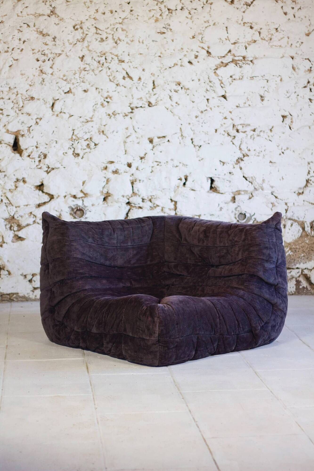 Togo aubergine corner armchair by Michel Ducaroy for Ligne Roset