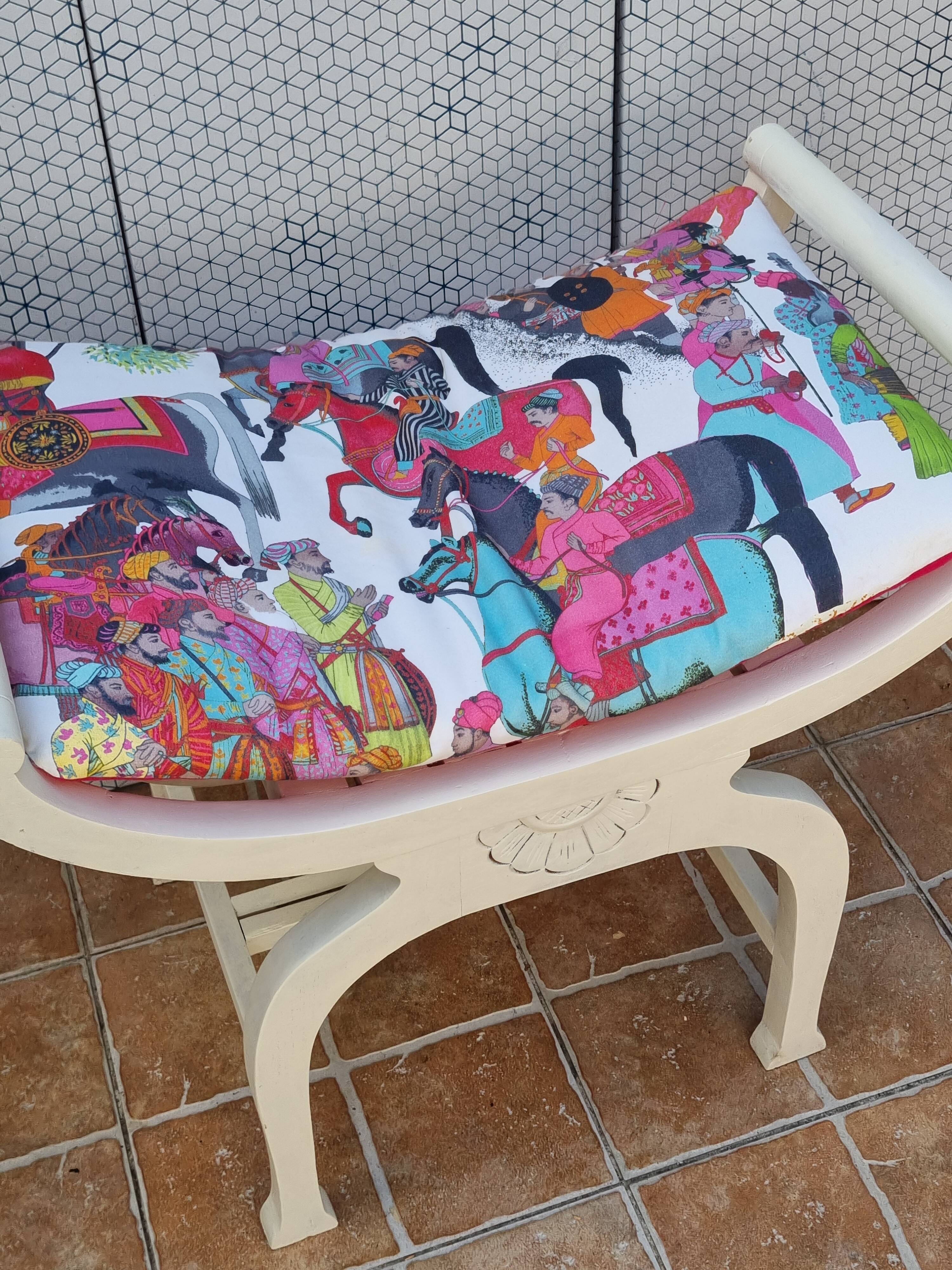 Curule stool in patinated carved wood, Manuel Canovas seat, 60 cm