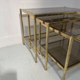 Set of three nesting tables in brass and smoked glass, 20th century