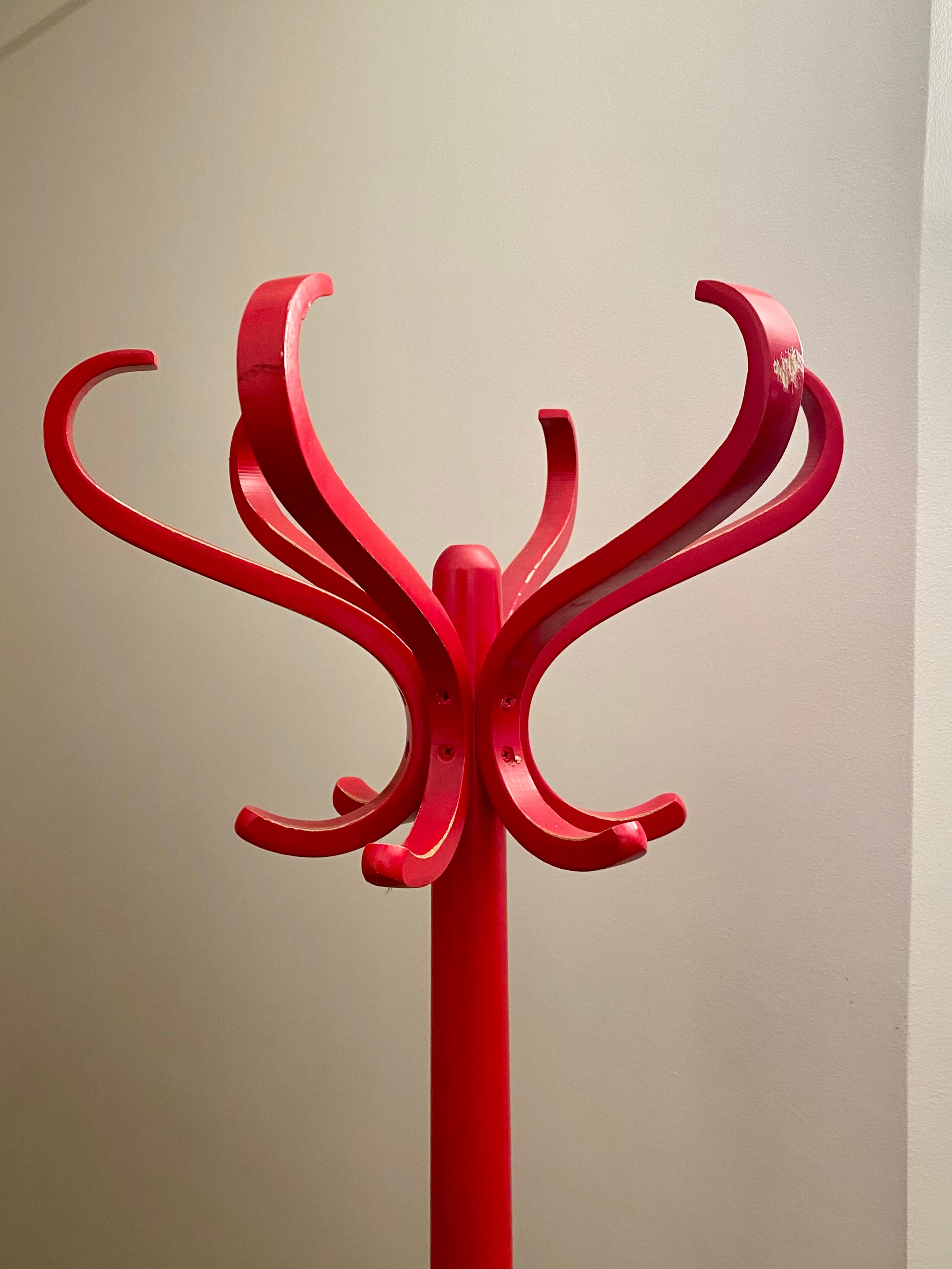 Red Baumann parrot coat rack