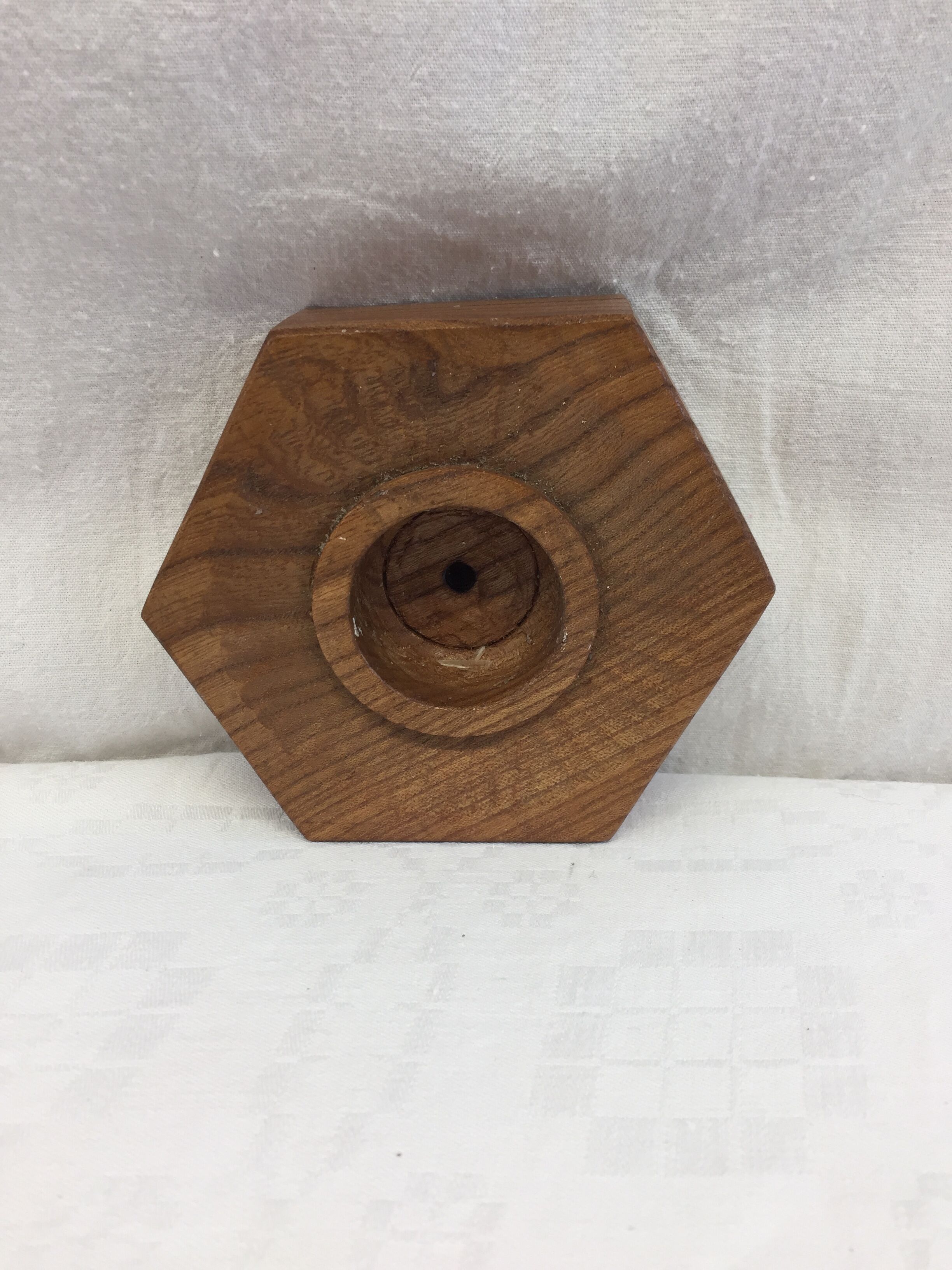 Handmade natural wood candle holder, hexagonal shape and its 3 old beeswax candles.