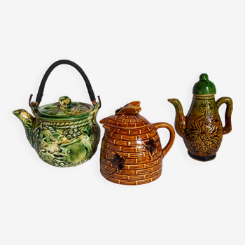Set of old teapots and honey pot