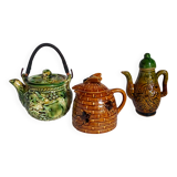 Set of old teapots and honey pot