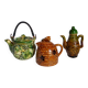 Set of old teapots and honey pot