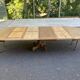 Round dining table with a central pedestal, stripped raw oak, 4 extensions, 19th century.