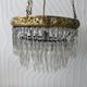 Vintage tassel chandelier has 2 glass and brass crowns