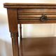 Pair of English mahogany side tables with sliding shelf.