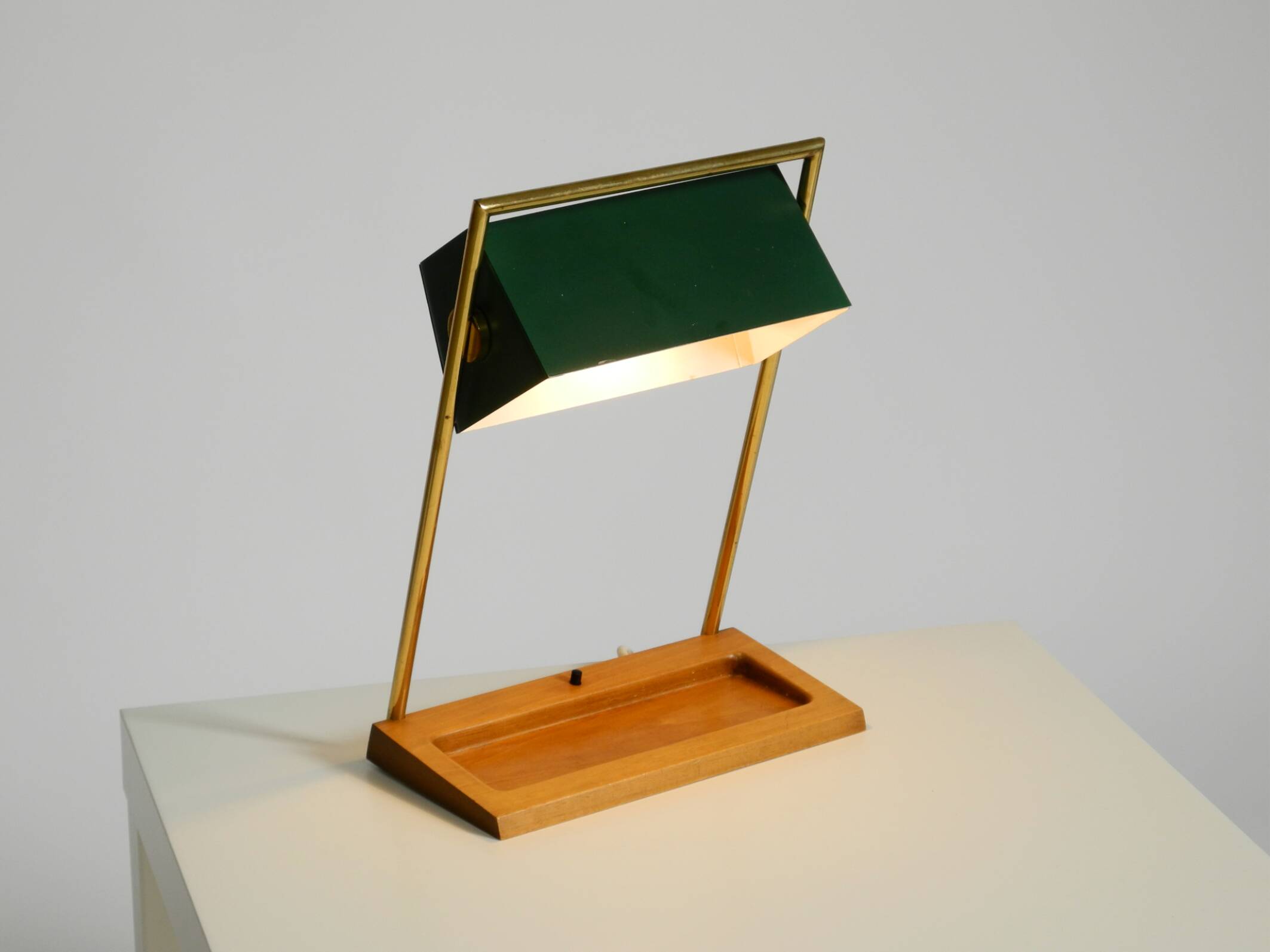 1960s Temde table lamp with a brass frame, teak base, and green lampshade