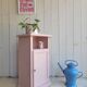 Antique bedside table revamped in pink.